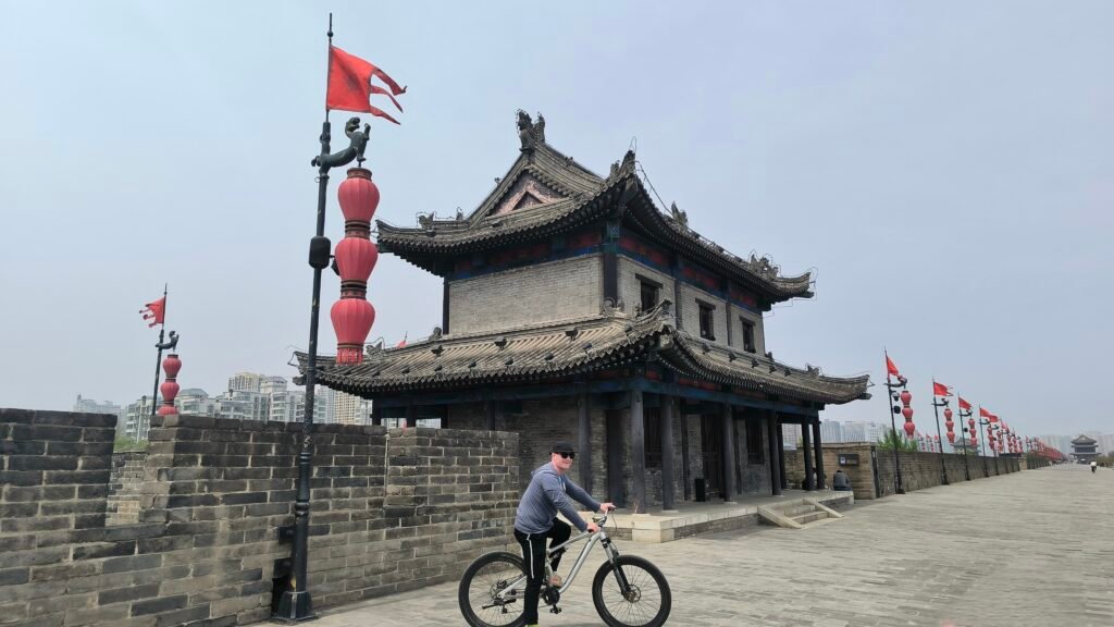 Tourists cycling atop Xi'an's historic City Wall, China