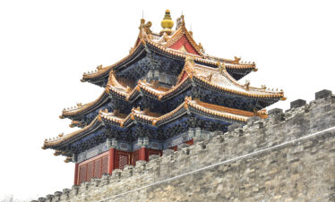 the forbidden city, snow view, beijing, chinatravel, Ornate multi-tiered Chinese temple roof with gold accents and upturned eaves atop a stone wall.