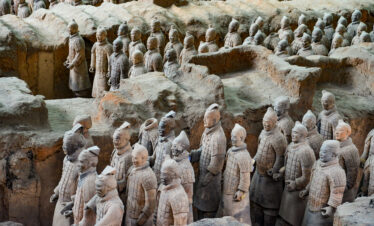 Terra Cotta Warriors, xi'an, china, china tour, Rows of life-size terracotta soldiers standing in long clay pits, part of China's Mausoleum of the First Qin Emperor.