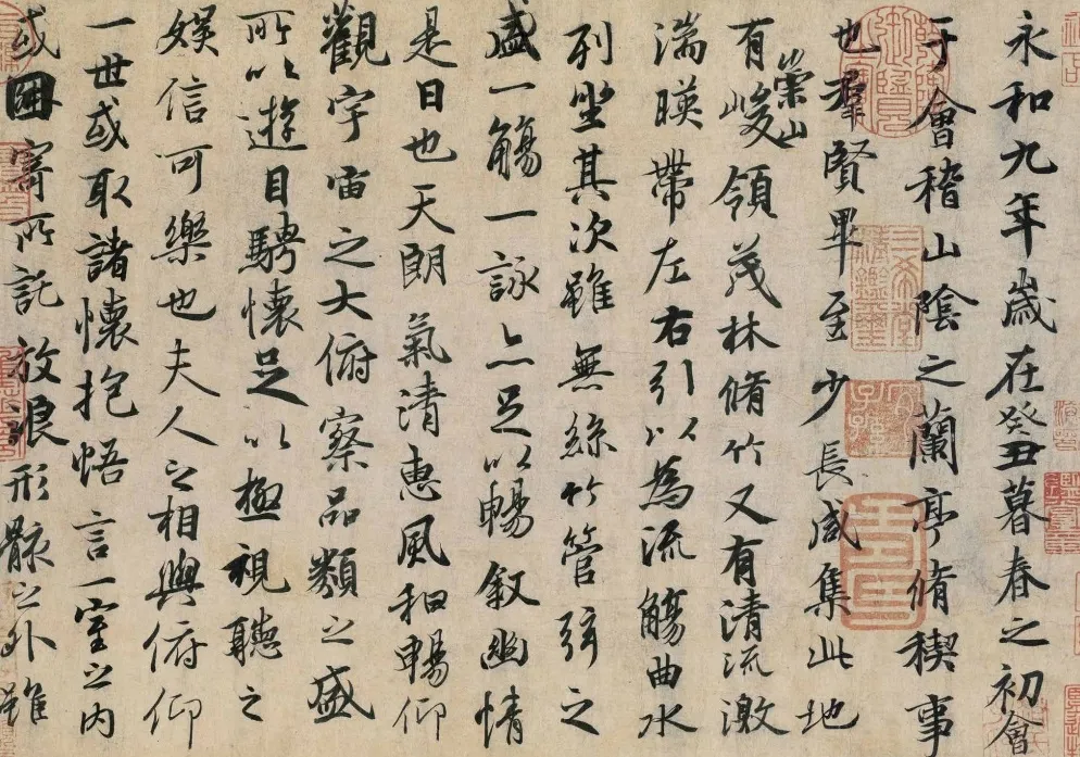 An accordion-style Chinese book featuring an excerpt from Wang Xizhi’s ‘Lantingji Xu,’ written in classical calligraphy. The pages are complemented with ink illustrations of natural elements. Dried flower petals and a fountain pen rest nearby, enhancing the cultural and artistic atmosphere.