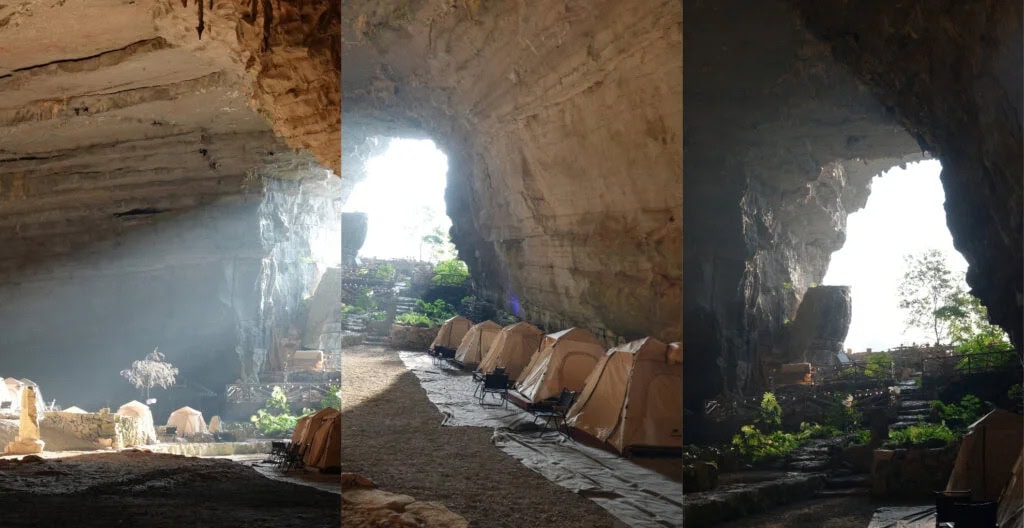 cave camping, guizhou, chinatravel, Campsite inside a large rocky cave with beige tents lined along a sunlit passage.