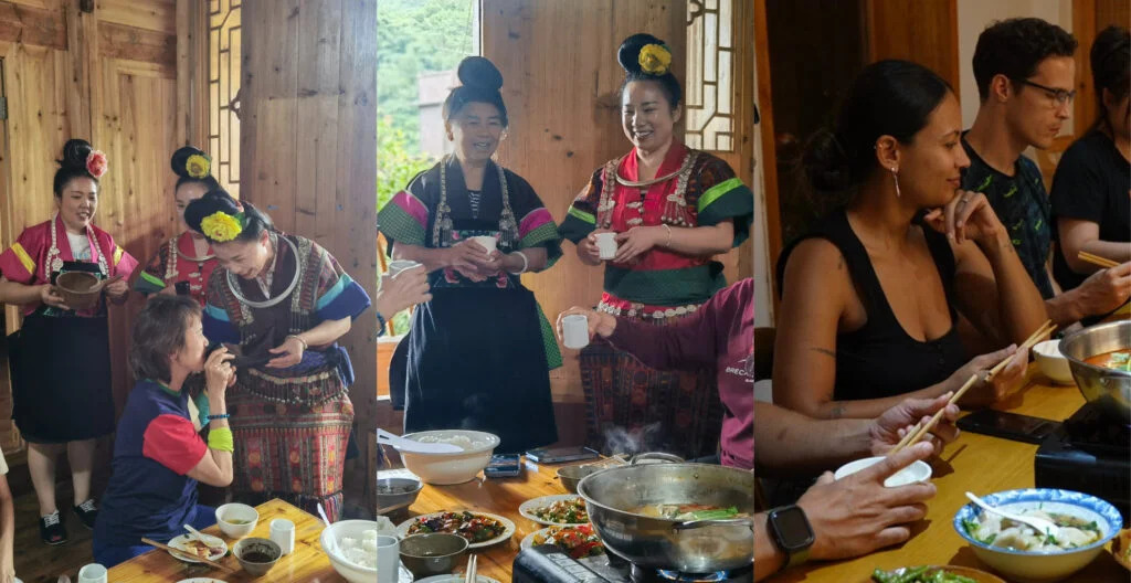 guizhou , chinatravel, Women in bright traditional dresses serve tea to guests at a wooden dining table during a cultural meal.
