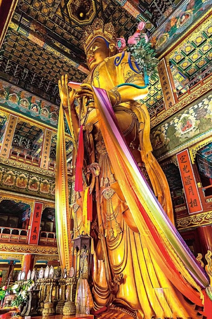 Maitreya Buddha at Yonghe Temple – 18m tall, carved from sandalwood, a sacred icon of Tibetan Buddhism.