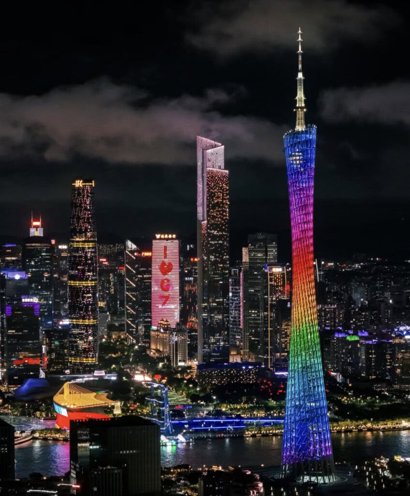 Shanghai,Chinatour Guangzhou skyline at night featuring the Canton Tower lit in rainbow colors beside the river.