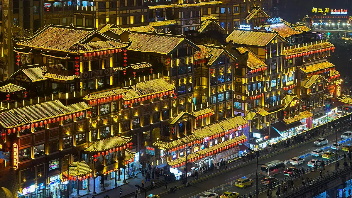 Hongya Cave,Chongqing,Chinatour Night view of a block of traditional Chinese buildings with yellow-tiled roofs and red lanterns along a busy street at night.