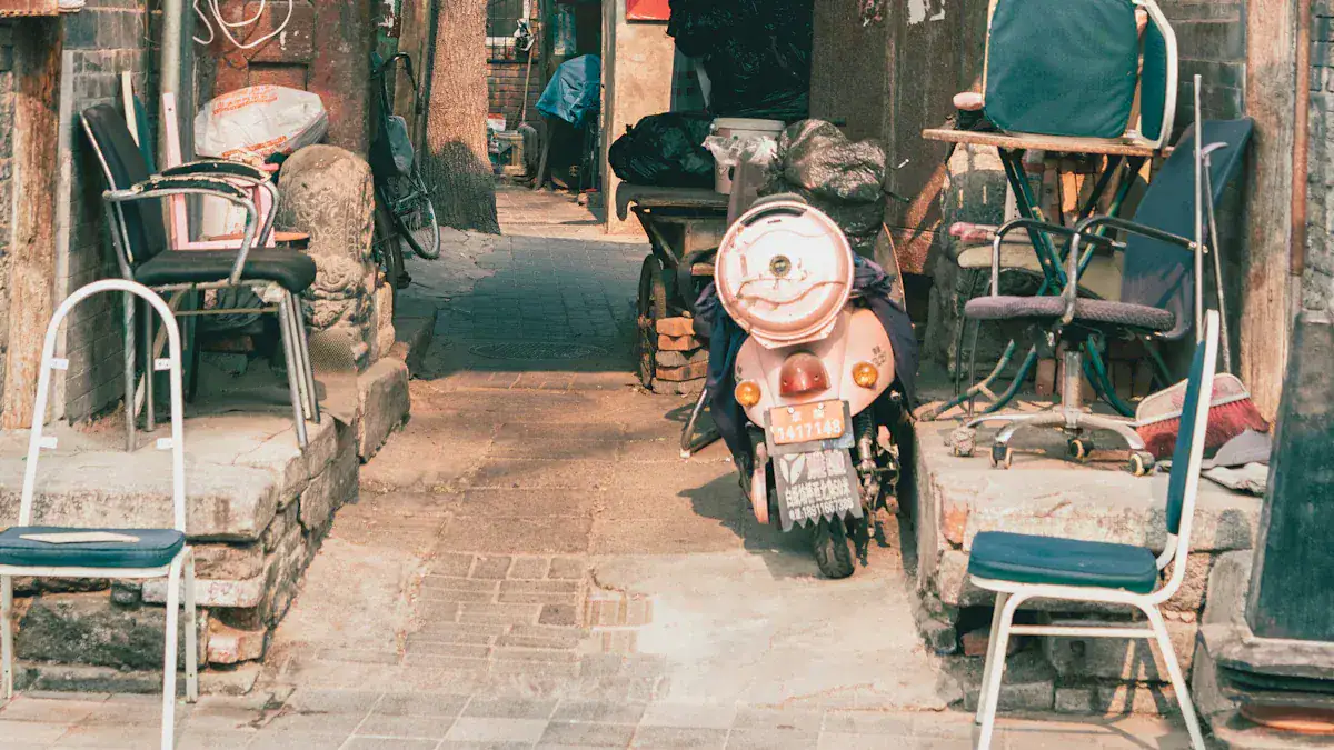 Beijing Hutong Tour,Chinatour Scooter parked in a narrow alley, flanked by chairs and scattered items, urban clutter all around.