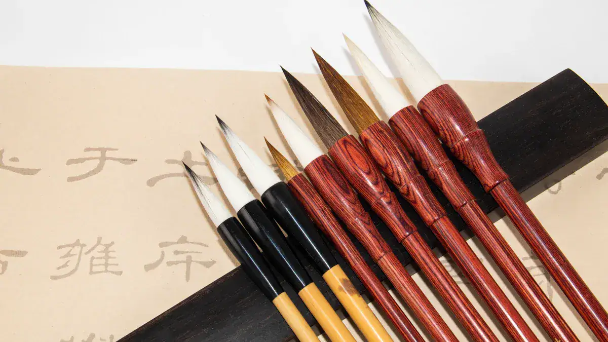 Set of Chinese calligraphy brushes with wood handles laid on parchment with script