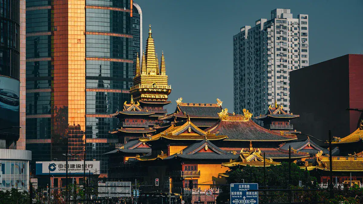 Golden traditional temple complex with ornate roofs in front of modern glass skyscrapers, showcasing urban contrast between ancient and contemporary China.