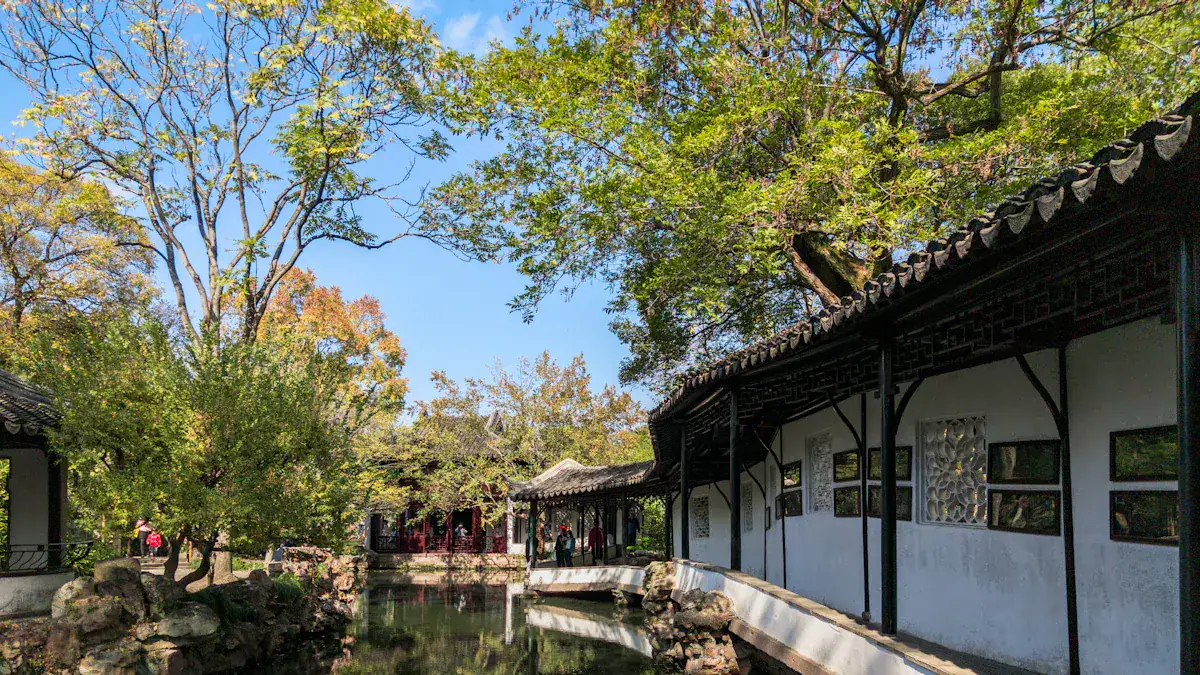 Humble Administrator's Garden,Suzhou,Chinatour Traditional Chinese garden with white-walled buildings, dark wooden beams, curved-tile roofs, and a reflecting pond.