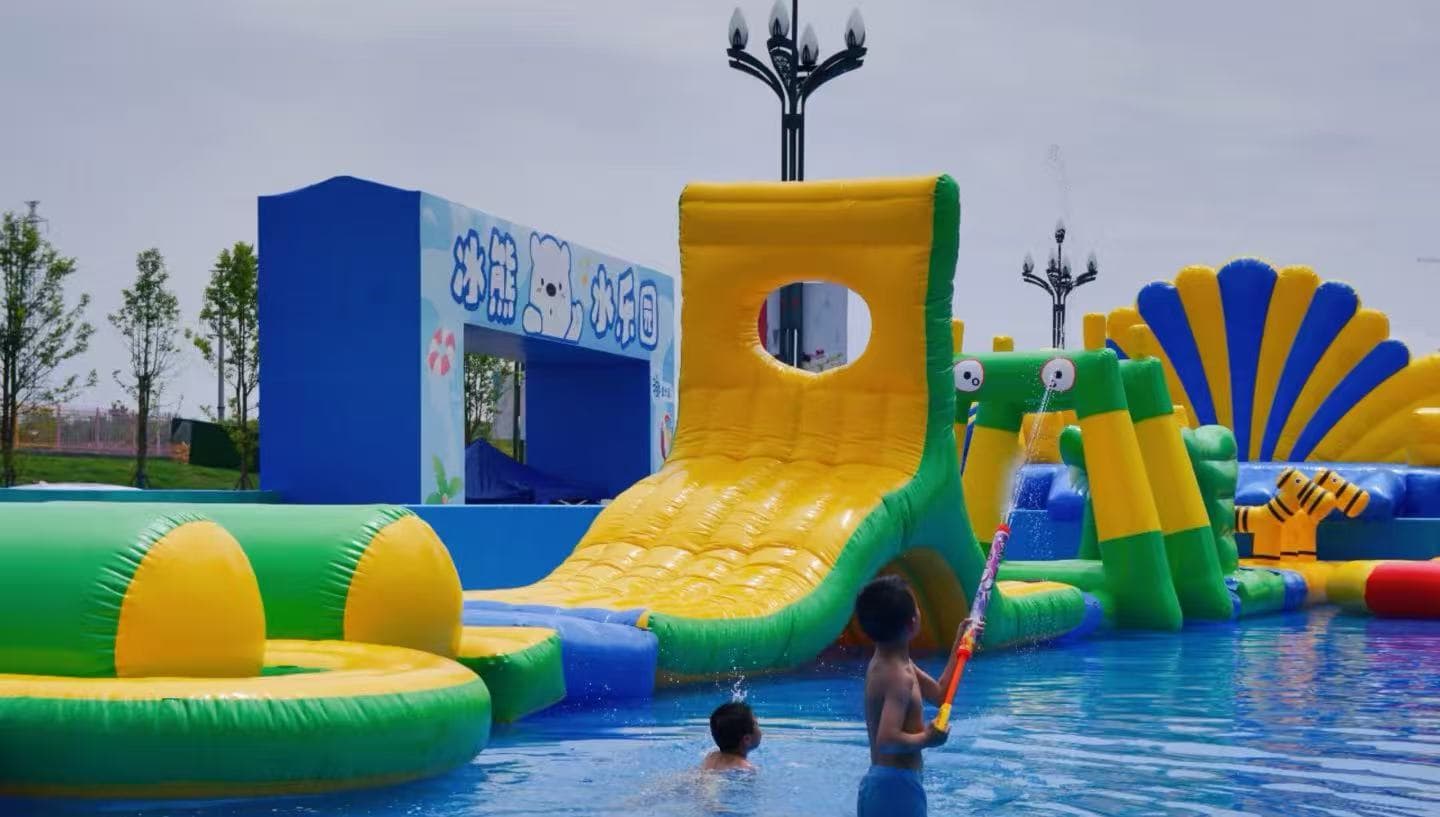 Leshan Happy Water World,Leshan,Chinatour Colorful inflatable water park with a large yellow slide, green and blue obstacles, and children playing in a pool.