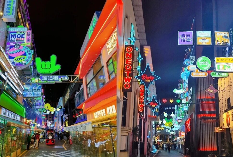 Neon-lit street in an East Asian shopping district at night with colorful signs and storefronts, pedestrians walking.Qingyun Market,Guiyang,Guizhou