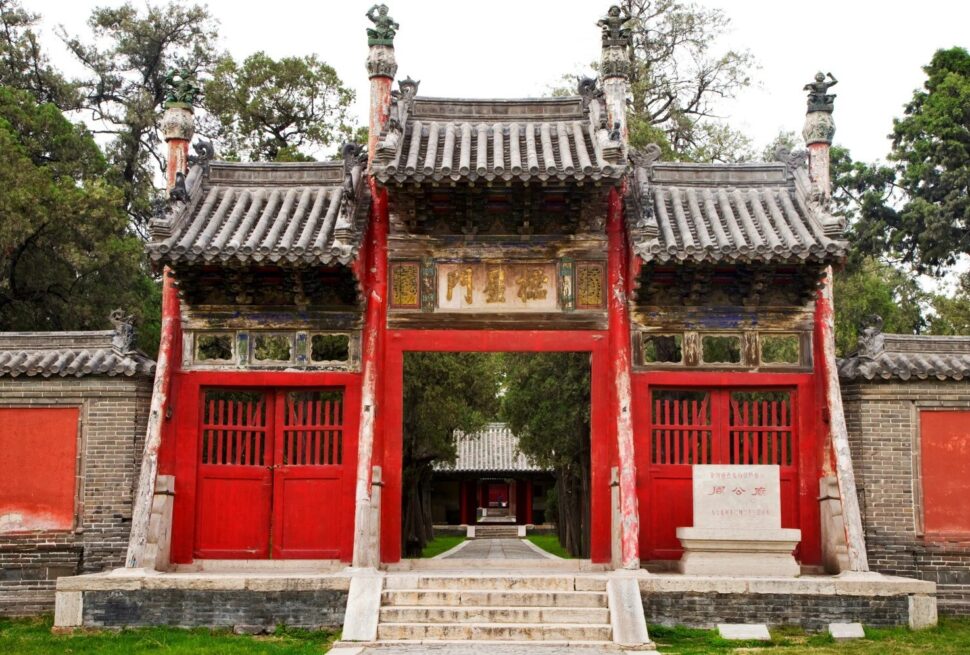 Confucius Mansion,Qufu,Chinatour Traditional Chinese temple gate with red wooden doors and ornate roof details.