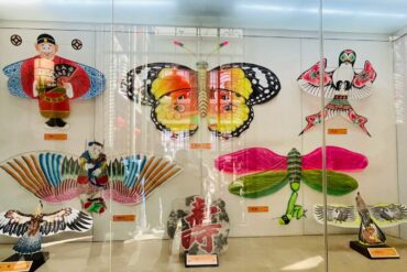A colorful display of traditional Chinese kites featuring a butterfly, dragonfly, and other cultural,Yangjiabu Folk Culture Village,weifang, shandong, chinatravel