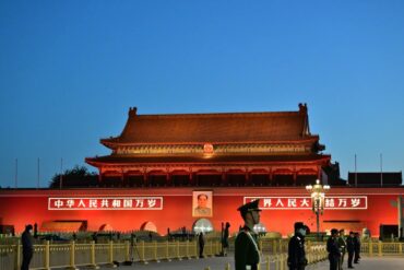 Tian`anmen Square,Beijing,Chinatravel Tiananmen Gate at sunset in Beijing, China, with guards and traditional architecture.