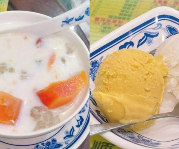 Shangxiajiu Pedestrian Street,Guangzhou,Chinatour Bowl of milk with chunks of fruit and jelly in a white bowl on a blue-patterned saucer.