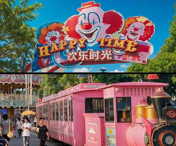 Shanghai Happy Valley,Shanghai,Chinatour Amusement park scene with a bright pink vintage train and a large colorful sign reading 'HAPPY TIME' with clowns, and visitors walking nearby.
