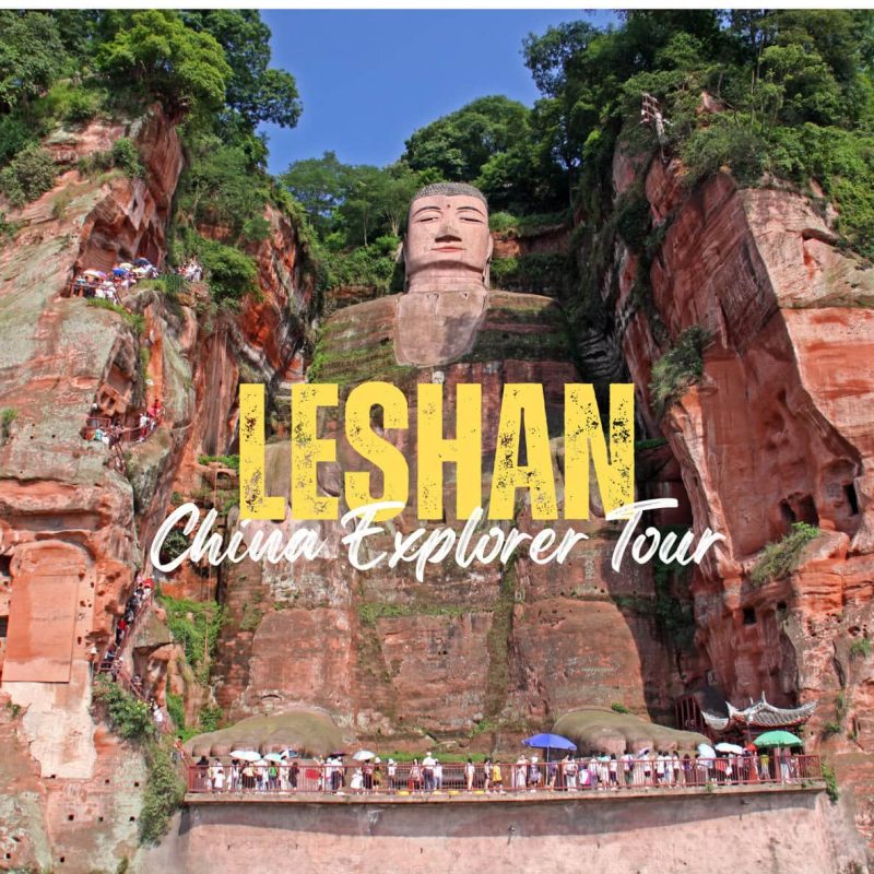 Leshan,Sichuan,Chinatravel Cliffside view of the Leshan Giant Buddha carved into red rock with tourists at the base and viewing platforms.