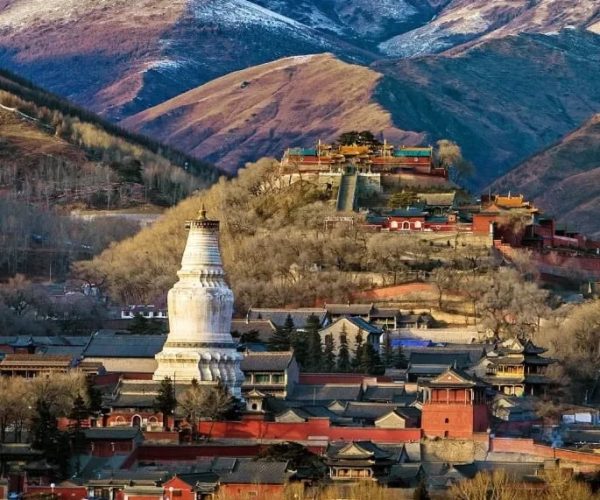 Mount Wutai,Xinzhou,Chinatravel White stupa on a hillside among temple buildings in a mountainous valley