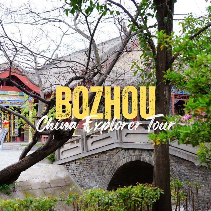 Bozhou,Anhiu,China tour Promotional image for Buzhou China Explorer Tour showing a stone arched bridge and temple with overlaid yellow text.