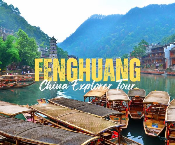 Fenghuang,Hunan,Chinatravel FENGHUANG China Explorer Tour banner over a riverfront with wooden boats and green hills in the background.
