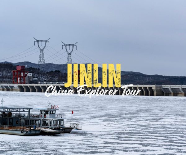Jilin,Jilin Province,China tour Promotional banner for JINN China Explorer Tour showing a dam and a boat on a river with branding text.