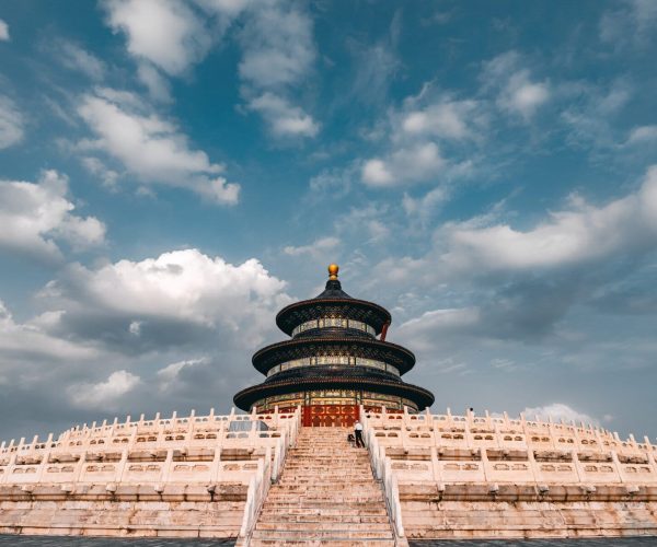 Temple of Heaven, beijing, chinatravel, Tiered circular pavilion atop white stone stairs against a blue sky, Temple of Heaven-style structure with gold top finial.