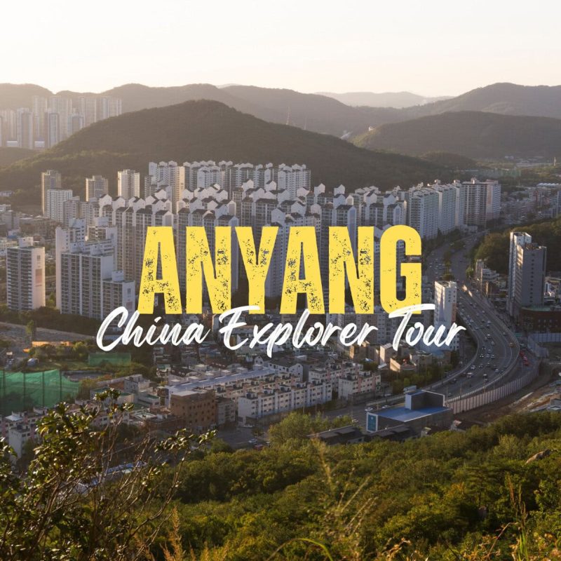 Anyang,Henan,Chinatravel Aerial cityscape with high-rise buildings and hills, overlaid by bold yellow 'ANYANG' and white 'China Explorer Tour' text (tourism hero image).