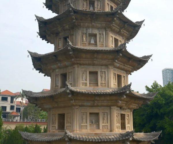 Guanghua Temple,Putian,Chinatravel Stone multi-tier Chinese pagoda with upturned eaves in a garden setting