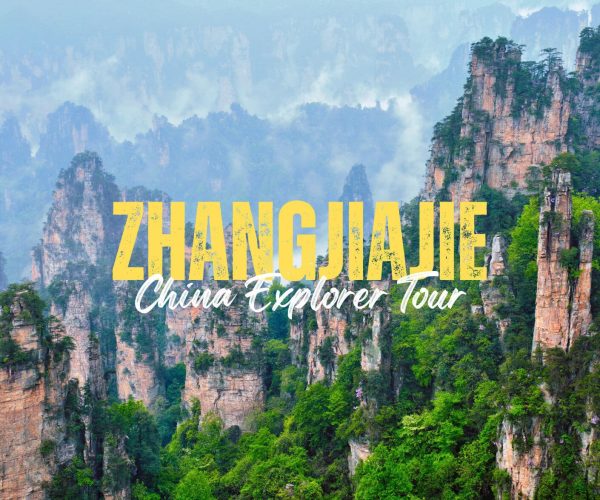 Zhangjiajie,Hunan,Chinatravel Promotional banner for Zhangjiajie China Explorer Tour with bold yellow text over misty limestone pillars in a forested canyon.