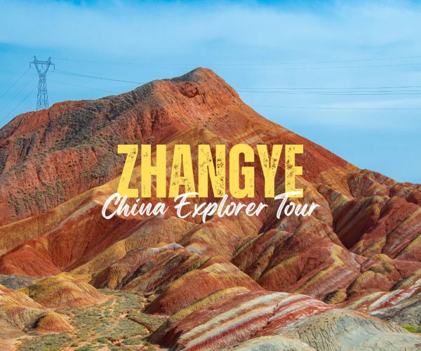 Zhangye,Gansu,China tour Promotional banner showing colorful Zhangye Danxia hills with overlaid text 'ZHANGYE' and 'China Explorer Tour'