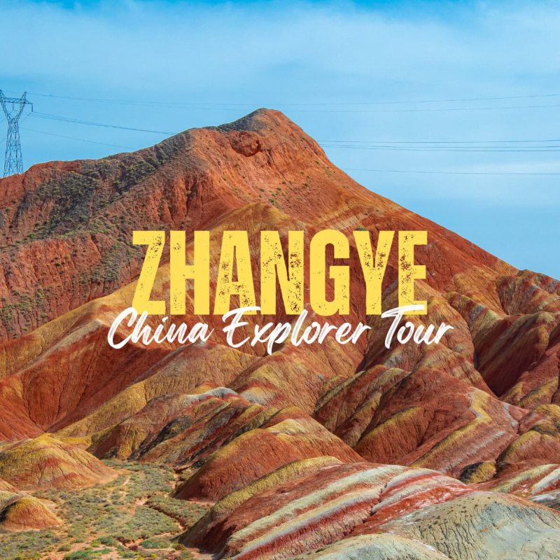 Zhangye,Gansu,China tour Promotional banner showing colorful Zhangye Danxia hills with overlaid text 'ZHANGYE' and 'China Explorer Tour'