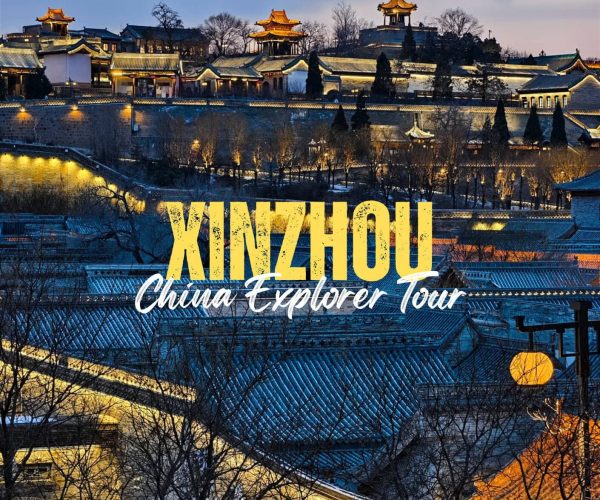 Xinzhou,Shanxi,Chinatravel Dusk view of illuminated Chinese palaces and tiled roofs with bold 'KINZHOU' and 'China Explorer Tour' text overlay on the scene