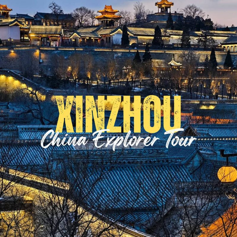 Xinzhou,Shanxi,Chinatravel Dusk view of illuminated Chinese palaces and tiled roofs with bold 'KINZHOU' and 'China Explorer Tour' text overlay on the scene