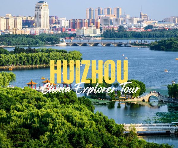 Huizhou,Guangdong,Chinatravel Hangzhou skyline over a lake with a curved stone bridge and lush green trees in the foreground; bold yellow 'HANGZHOU' and white script text 'China Explorer Tour' overlaid.