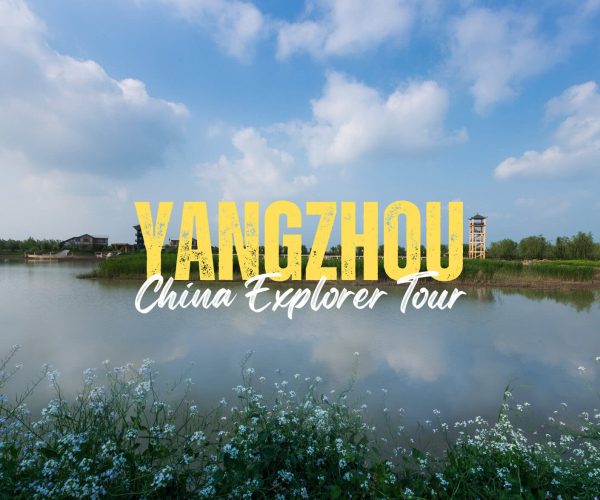 Yangzhou,Jiangsu,China tour Promotional banner: 'Yangzhou China Explorer Tour' over a calm lake with blue sky and distant buildings.
