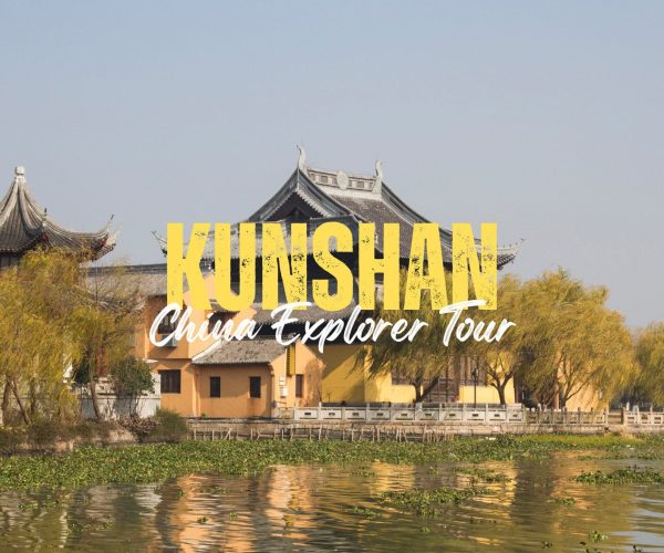 Kunshan,Jiangsu,China tour Promotional image for Kunshan China Explorer Tour showing a traditional Chinese temple by a waterway with trees and bold yellow text 'KUNSHAN'.