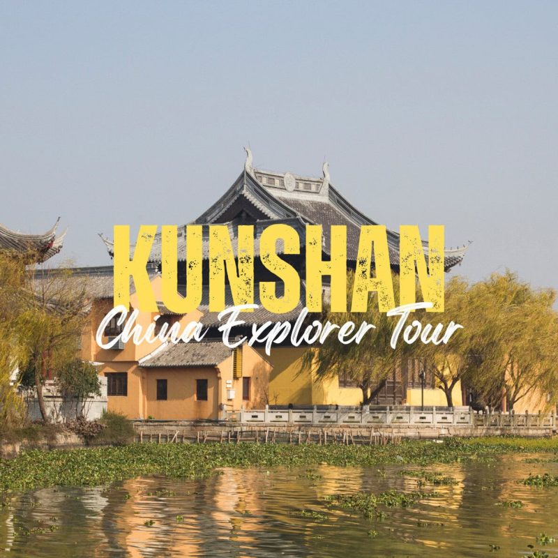Kunshan,Jiangsu,China tour Promotional image for Kunshan China Explorer Tour showing a traditional Chinese temple by a waterway with trees and bold yellow text 'KUNSHAN'.