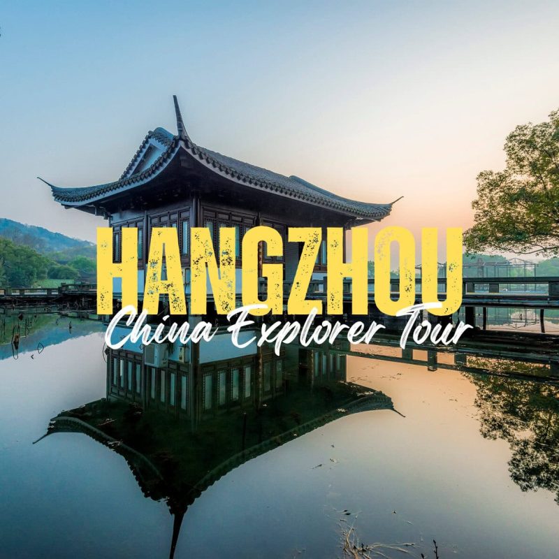 Hangzhou,Zhejiang,Chinatravel Promotional image of a traditional pavilion on a calm lake at sunset in Hangzhou, with large yellow 'HANGZHOU' and white 'China Explorer Tour' text overlaid, reflecting in the water.