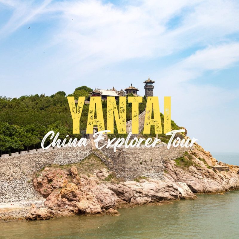 Yantai,Shangdong,China tour Promotional banner for Yantai China Explorer Tour: large yellow ‘YANTAI’ text over a coastal fortress on rocky cliffs by the sea.