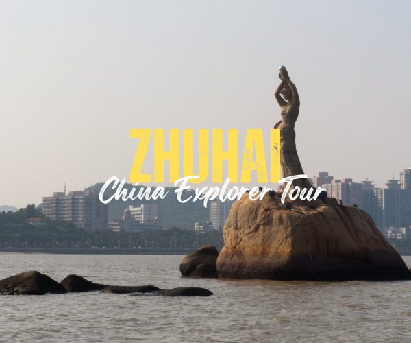 Zhuhai,Guangdong,Chinatravel Tour poster for Zhuhai featuring the statue on a rock in the bay, with a city skyline in the background and the yellow 'ZHUHAI' plus 'China Explorer Tour' script overlay.