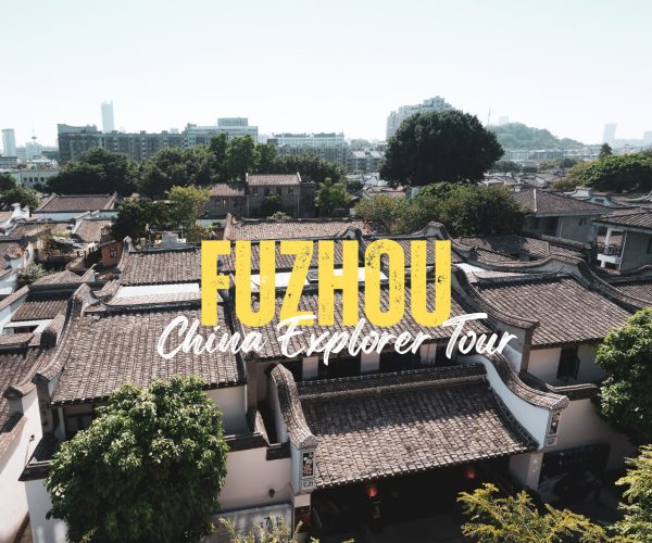 Fuzhou,Fujian,Chinatravel Promotional banner for Fuzhou China Explorer Tour with traditional tiled rooftops and a city skyline behind the bold yellow 'FUZHOU' text.
