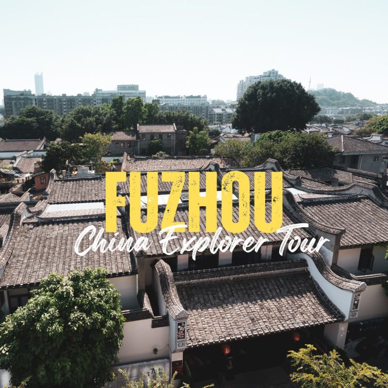 Fuzhou,Fujian,Chinatravel Promotional banner for Fuzhou China Explorer Tour with traditional tiled rooftops and a city skyline behind the bold yellow 'FUZHOU' text.