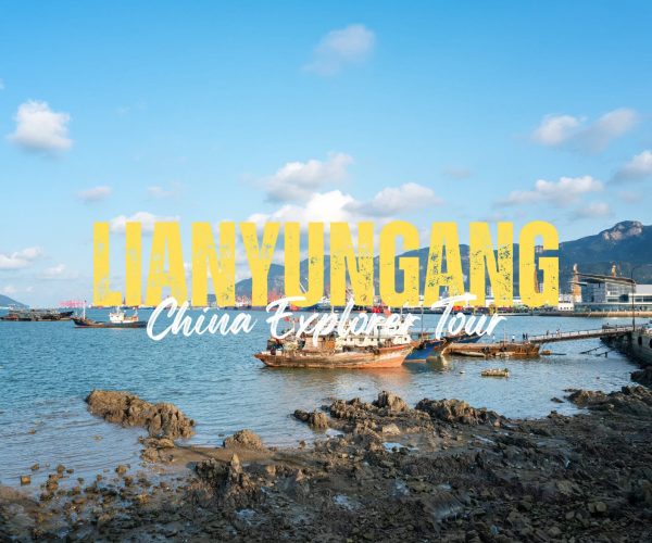 Lianyungang,Jiangsu,China tour Harbor scene with boats on calm water and rocky shore, overlayed by bold yellow text 'LIANYONGANG' and white cursive 'China Explorer Tour'