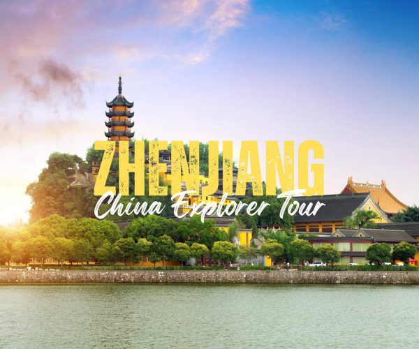 Zhengjiang,Jiangsu,China tour Promotional banner for ZHENJIANG China Explorer Tour with a multi-tier pagoda beside a river and traditional buildings at sunset.