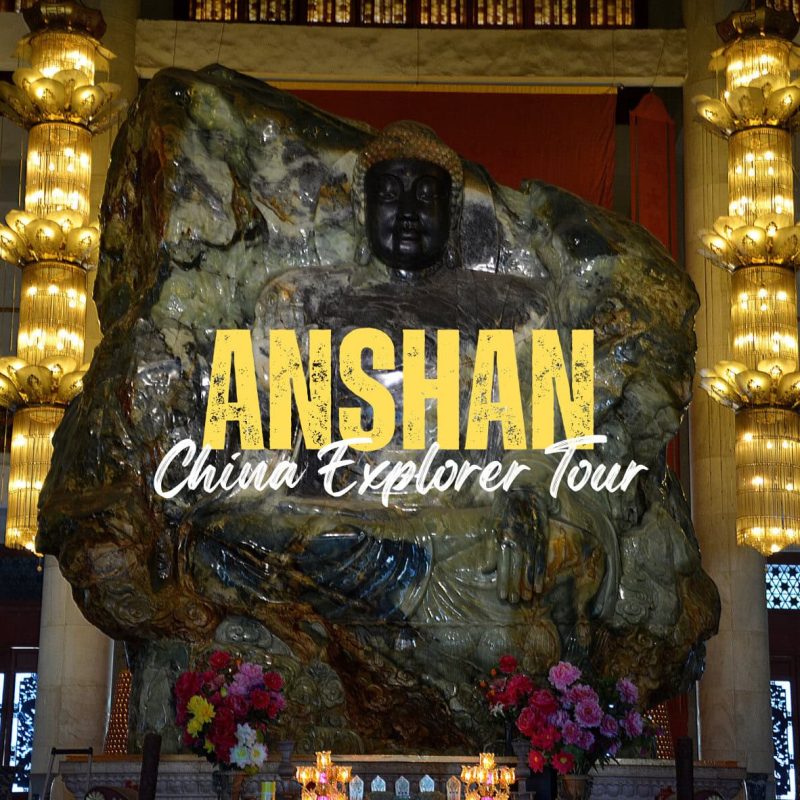 Anshan,Liaoning,China tour Stone statue of a seated figure in a lit temple, with bold yellow 'ANSHAN' and white cursive 'China Explorer Tour' text overlaid