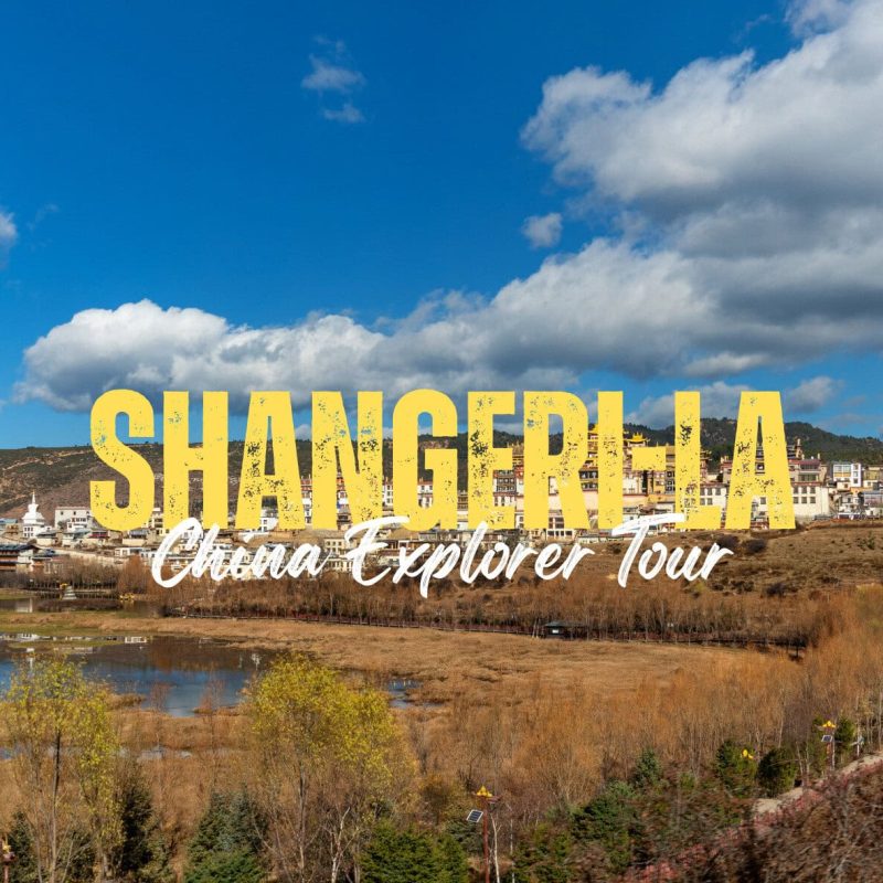 Shangri-La,Yunan,Chinatravel Promotional banner for Shangri-La: China Explorer Tour over a hillside town with a blue sky backdrop.