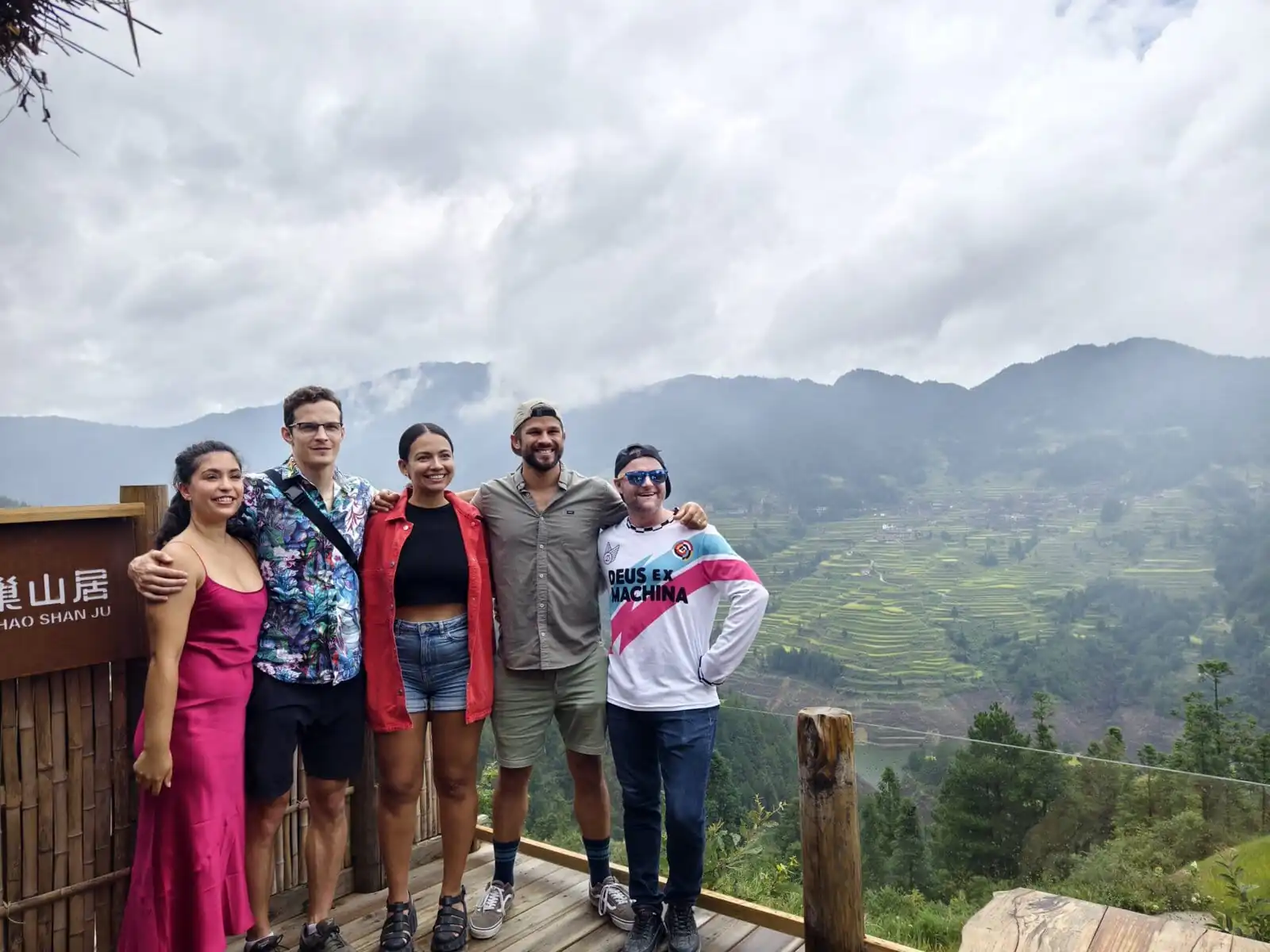 5-Day Hidden Gem - Guizhou Retreat: Caves, Culture, and Culinary Delights, china, china tour, Five friends posing together on a wooden overlook with misty mountains and terraced hills in the background.