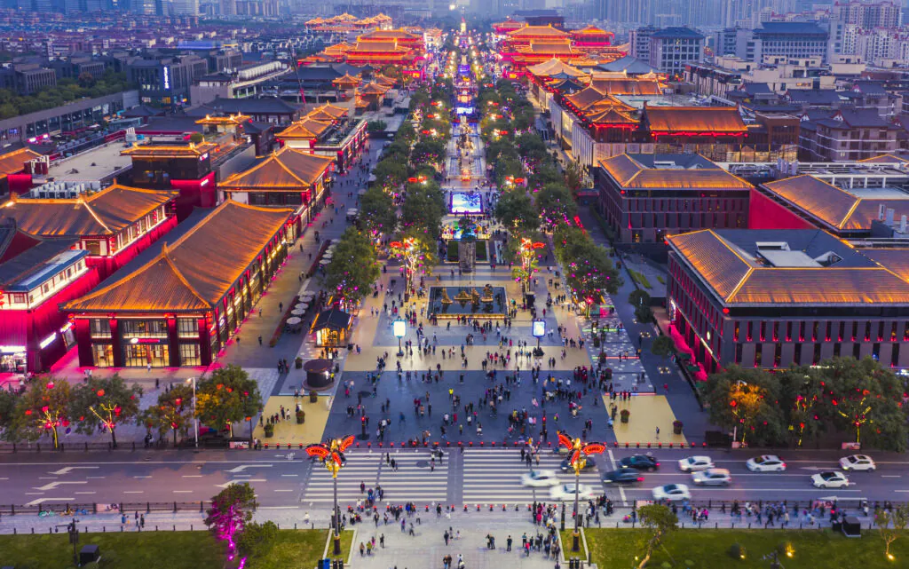 Lively Ever-Bright City walking street in Xi'an, China, filled with shops and entertainment.