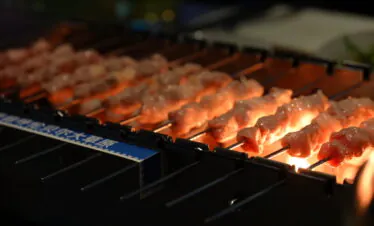 beijing, chinese food, china, china tour, Skewers of meat grilling over an open flame on a barbecue