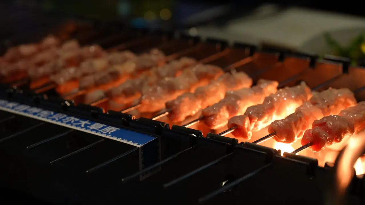 beijing, chinese food, china, china tour, Skewers of meat grilling over an open flame on a barbecue